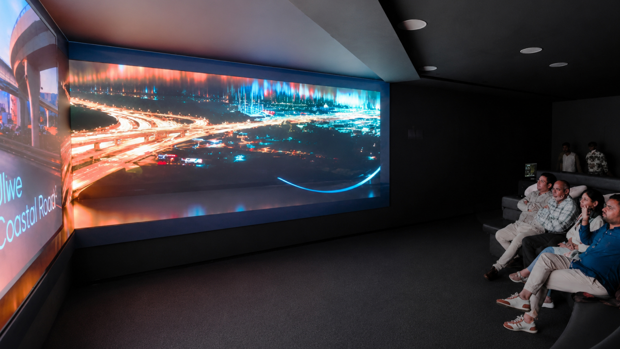 Immersive projection room with visitors watching a coastal road experience